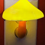 Super cute mushroom light! This nightlight plugs directly into any wall outlet. The mushroom light slowly cycles through different colors on its own. They give just enough light to keep from bumping into walls. The mushroom cap measures 3.25" in diameter & approx. 4.5" tall.