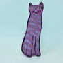 Purple cat-shaped object on a light blue background