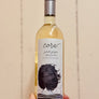 Wine bottle labeled 'cora' with a decorative label featuring a woman's silhouette against a beige background.
