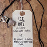 Whistle with a tag on a wooden surface