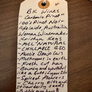 Handwritten note about BK wines wine on a wooden surface.