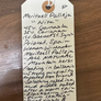 Handwritten note about Mertxell Palleja on a wooden surface