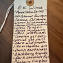 Handwritten tag from E K Wines on a wooden surface