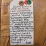 Handwritten tag on a wooden surface with product description and price.
