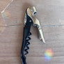 Corkscrew on a wooden surface
