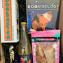 This box includes Vinovore Desert Nights Pēt-Nat half bottle, Dogstrology book, Dogsaster Stacking Game, one pack of Cosmicos Treats (must choose your flavor) and a corkscrew opener (must choose your color).