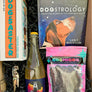 This box includes Vinovore Desert Nights Pēt-Nat half bottle, Dogstrology book, Dogsaster Stacking Game, one pack of Cosmicos Treats (must choose your flavor) and a corkscrew opener (must choose your color).
