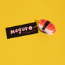 Sushi-shaped hair clip with 'Maguro' label on a yellow background