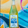 Bottle of Flavia Alle with colorful abstract background