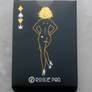 Black card box with gold illustrations and 'Rogue Paq' branding on a gray surface
