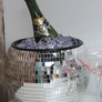 disco ball ice bucket with bottle of champagne and glass