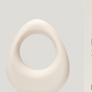 White 'band.' vibrating ring by Maude with packaging on a light gray background