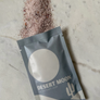 Desert Moon herbal bath soak packaging on a textured surface