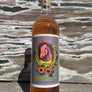 97% Sauvignon Blanc, 3% Langonesi Emilia-Romagna Italy.  Woman winemaker - Coly Den Haan! All natural. Luck be a shiny, wild peach pony tonight... Frolicking through a field of hibiscus and daisies.  Pink barn dust kicked up by sage boots during a berry ho-down!