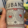 Shiraz/Cinsault/Mourvedre/Grenache Swartland, S. Africa.  Woman winemaker - Trizanne Barnard. Sustainable. Brooding and earthy with an upbeat lift. Sour cherries. Charcoal BBQ. Bruised peppermint. Charred dirt + blackberries. Can = half a full bottle.