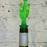 Assorted acrylic wine stoppers. Pick your faves! Bling ring in blue or clear, green palm tree or cactus, orange sun. Sold individually.