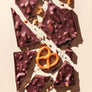 California Love by Compartés Chocolates Los Angeles. Gourmet handmade dark chocolate bar made with gourmet dark chocolate and tons of crushed San Francisco sourdough pretzels. This combo is the ultimate meeting of dark chocolate, sea salt, and crunch.