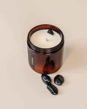 A soothing scent that brightens a room with coconut and vanilla. Made with a genuine Obsidian crystal nested inside the candle adds more meaning to your experience. Obsidian is known for blocking negativity to those who keep it.