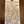 A handwritten wine tag for Alta Alella Cellar 'AVS' Pet-Nat Red, detailing the wine's characteristics and ingredients, placed on a dark wooden surface.