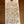 A handwritten paper tag on a wooden surface listing flavor and ingredient details for Biscaris Sicily 100% Frappato Sicily.