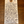 A handwritten wine label tag on a wooden surface, listing Château Lestrille-Capmatin and several Bourgogne wine varietals and descriptors.