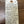 Handwritten wine label on a wooden surface