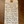 Handwritten wine label on a wooden surface
