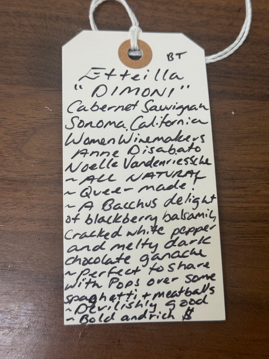 Handwritten label on a wooden surface