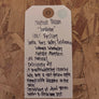 Tag with product description on a wooden background