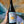 Bottle of La Villana Bianco wine in front of a colorful background