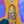 Bottle of Angelino Wine Company Albarino held against a colorful abstract background