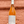 Bottle of rose wine held against a wooden background