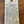 Handwritten tag with wine description on a wooden surface