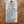 White tag with black text on a wooden background