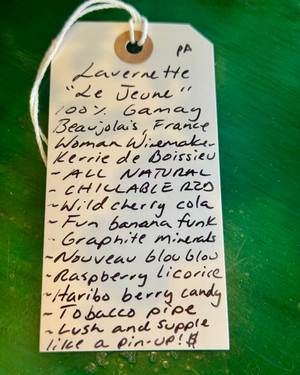 Handwritten tag on a green background with product description
