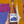 Bottle of Delta Brut Rose held against a colorful abstract background