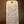 Handwritten tag with product details on a wooden surface