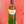 Bottle of wine held against a red background