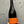 Bottle of La Cinsa wine held against a gray background
