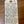 Handwritten label on a wooden surface