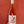 Bottle of rose wine with a label featuring an illustration against a red background