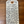 Handwritten label on a wooden surface with product details.