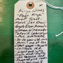 Handwritten tag on a green surface with text about Krya Wines.