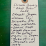 Handwritten label about Shibata Brewery Black Yuzu Sake on a green background
