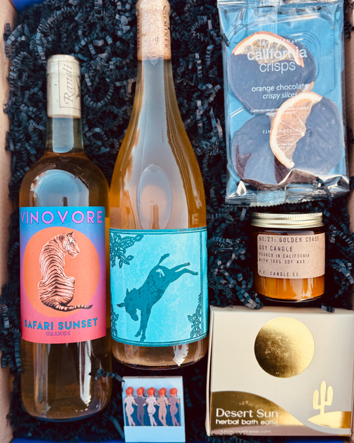 Our Orange is The New Box includes Vinovore Safari Sunset Orange, Solminer Field Blend Orange, Rogue Paq Yes We Cann-Cann Matches, Crispy Dark Chocolate Orange Slices, P.F. Golden Coast Mini Candle - 3.5 oz.