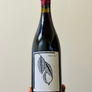 Bottle of 'Picker's Rad' wine held against a plain background