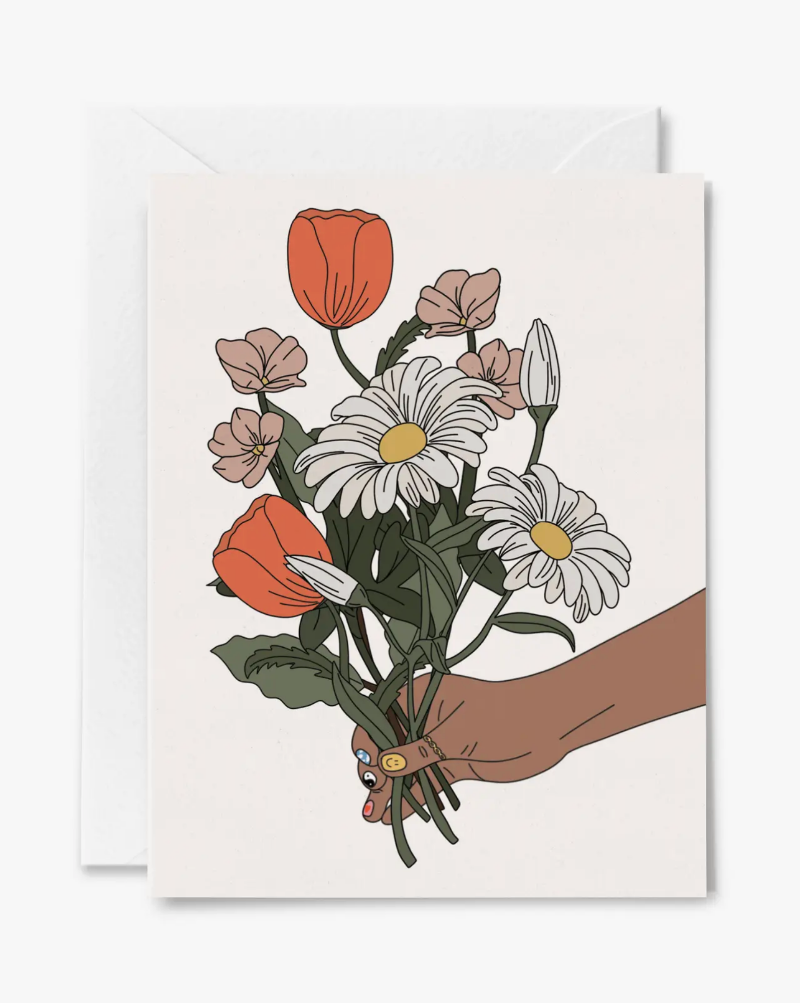 Hand holding flower bouquet card. Blank inside.