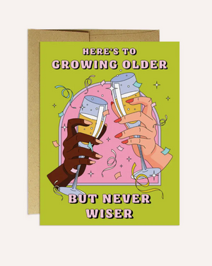 Here's to Growing Older But Never Wiser card. Blank inside