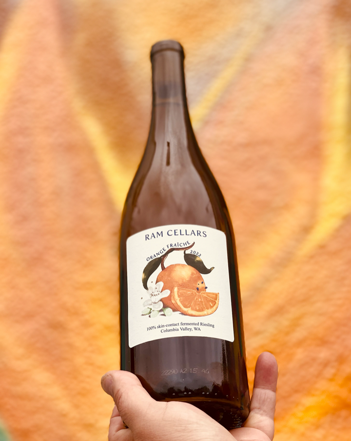 100% Riesling. Columbia Valley, Washington.  Woman winemaker - Vivianne Stardust Kennedy. All Natural. Orange Wine. Transgender winemaker. Drinks like a light bodied red with a zesty, citrus, melon packed punch! Like a Spring sunset fading into tangerine dreams with a cool jasmine ocean breeze.