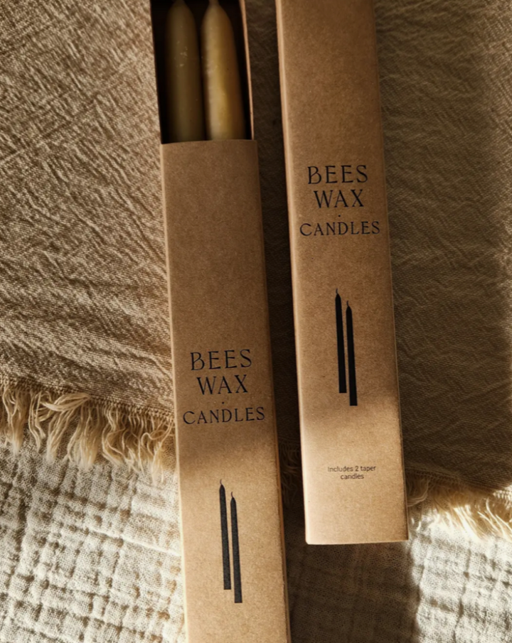 100% beeswax Hand dipped Each box Includes 2 taper candles When lit, the candles produce a soft, honey-like aroma, and beautiful warm glow. Beeswax is the only known fuel that actually cleans the air of dust, odours, molds, viruses and environmental toxins by emitting negative ions when burned.  Beeswax is naturally and sustainably produced by honeybees.  Woman Owned